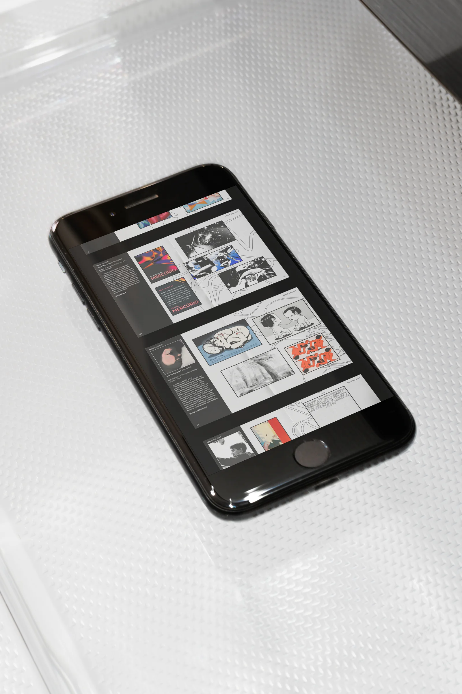 The fanzine spreads shown on a phone screen
